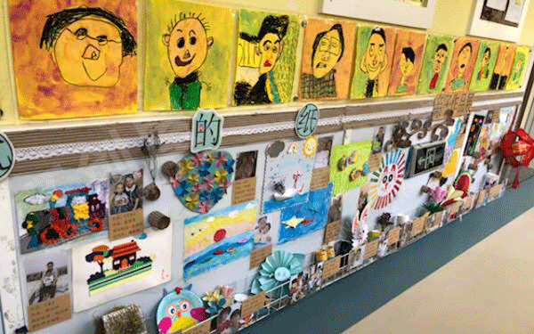 幼儿园纸的家族墙面布置环创图片
