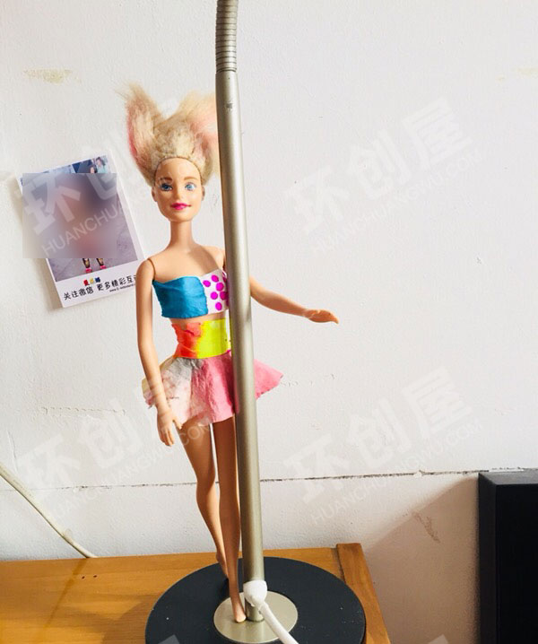 幼儿园角色区给娃娃制作漂亮衣服图片