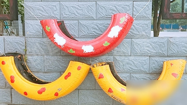 幼儿园废物利用轮胎户外卡通创意画图片