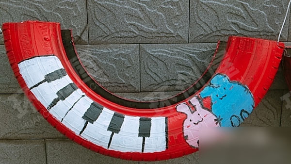 幼儿园废物利用轮胎户外卡通创意画图片