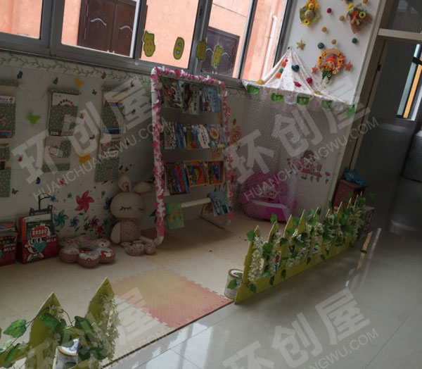 幼儿园阅读区绿色系读书角图片