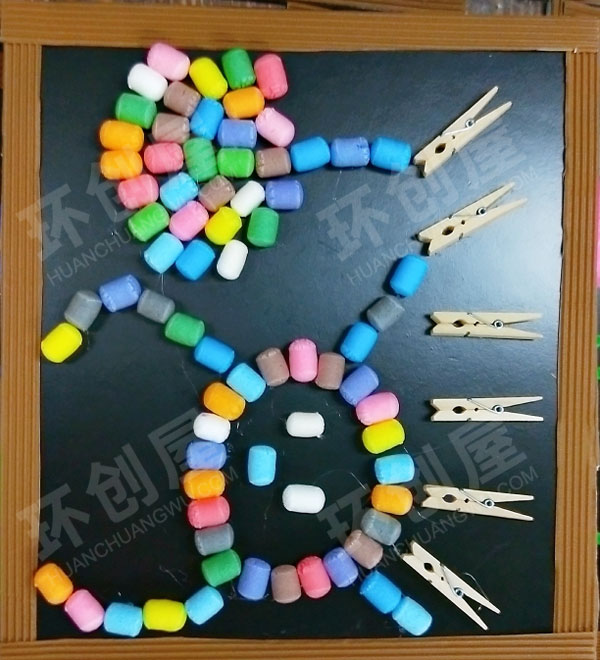 幼儿园墙面布置废物利用触摸墙图片