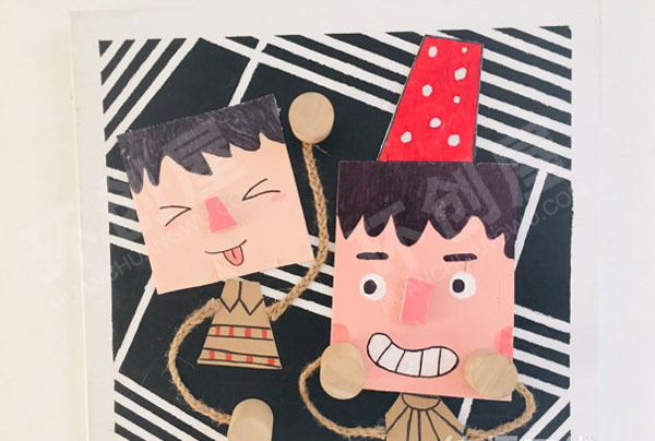 幼儿园废物利用硬纸板卡通人物墙面布置图片