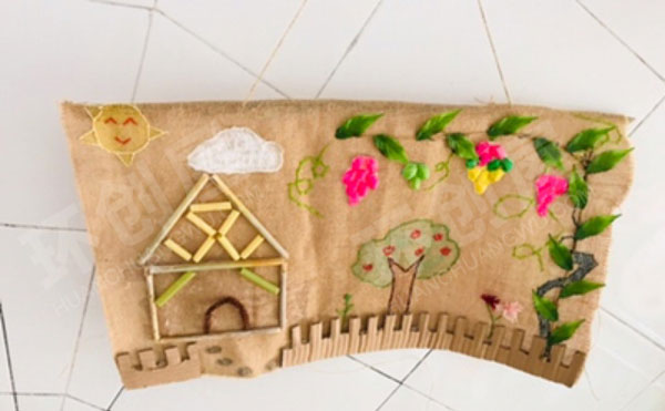 幼儿园石头贝壳麻布手工绘画作品墙面布置图片