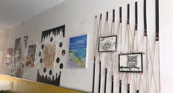 幼儿园楼道墙面布置木棍线绳作品图片