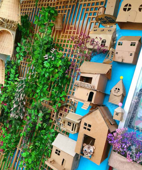 幼儿园户外废物利用纸盒木片墙面蜗牛环创图片