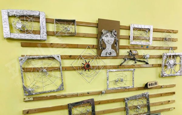 幼儿园益智区废物利用纸趣蜘蛛网环创图片