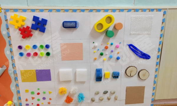 幼儿园科学区废物利用各种触摸墙环创图片
